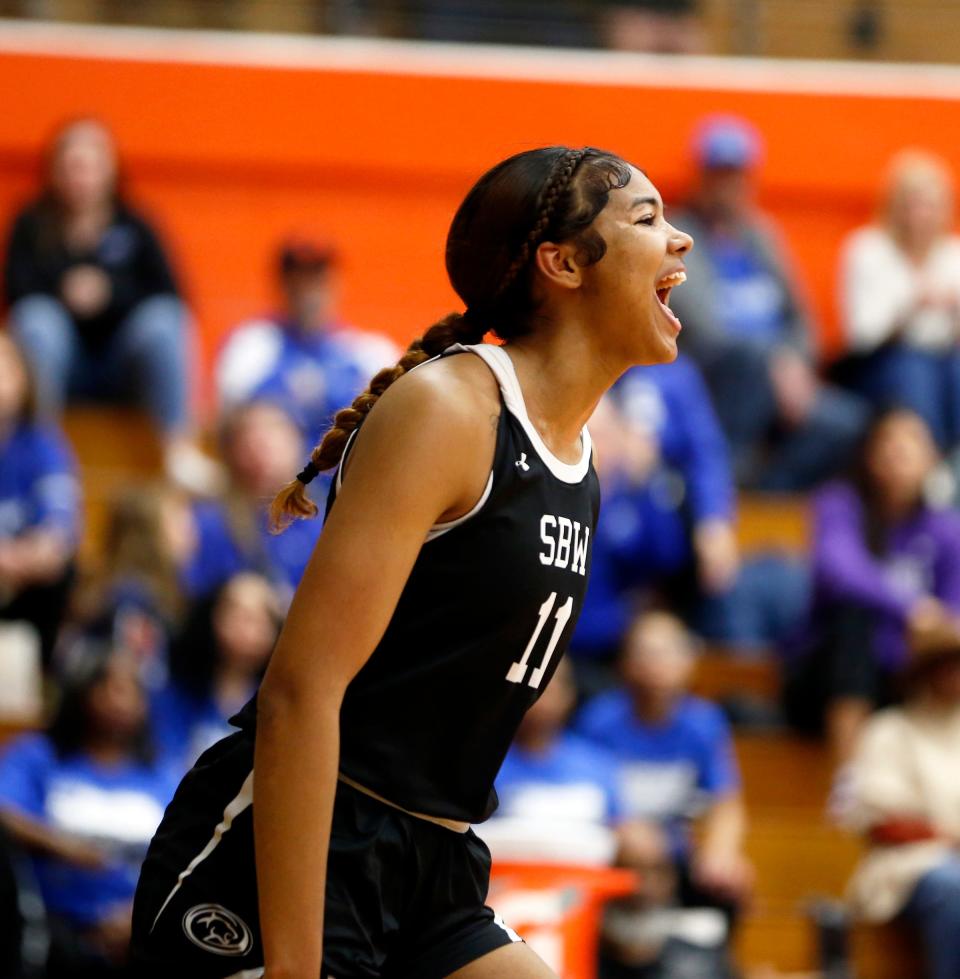 South Bend Washington junior Kira Reynolds celebrates after making a shot while drawing a foul during a Class 4A regional girls basketball championship game against Lake Central Saturday, Feb. 10, 2024, at LaPorte High School.