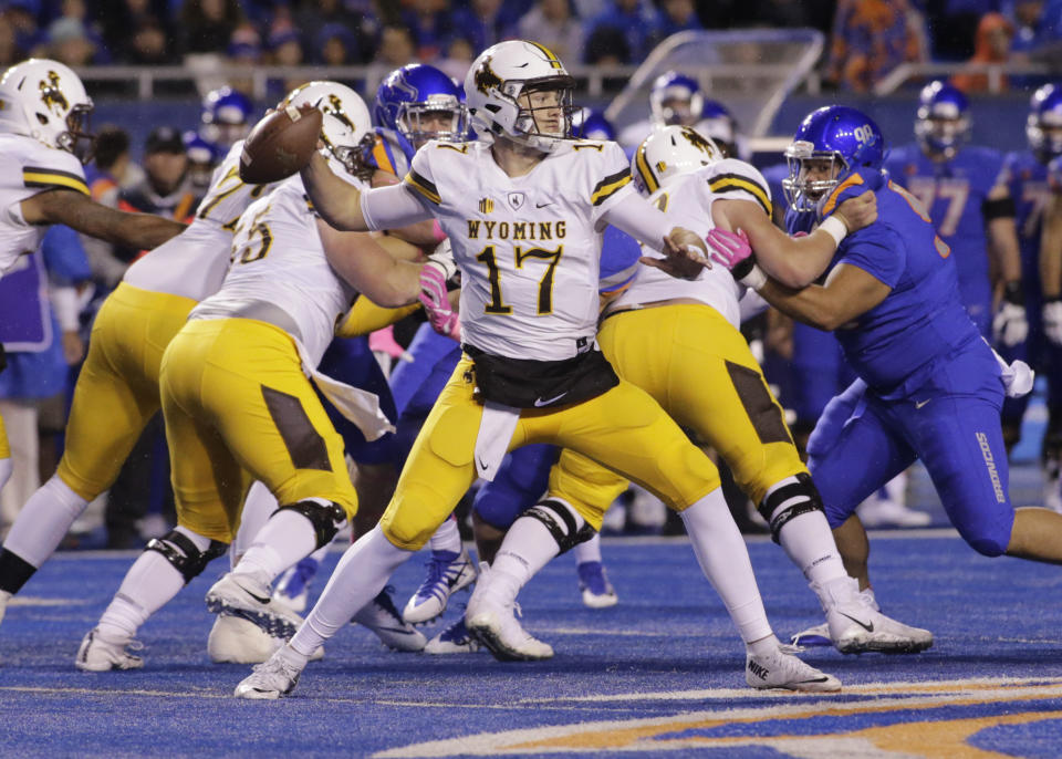 Wyoming quarterback Josh Allen (17) threw for three scores in the Potato Bowl. (AP Photo/Otto Kitsinger)