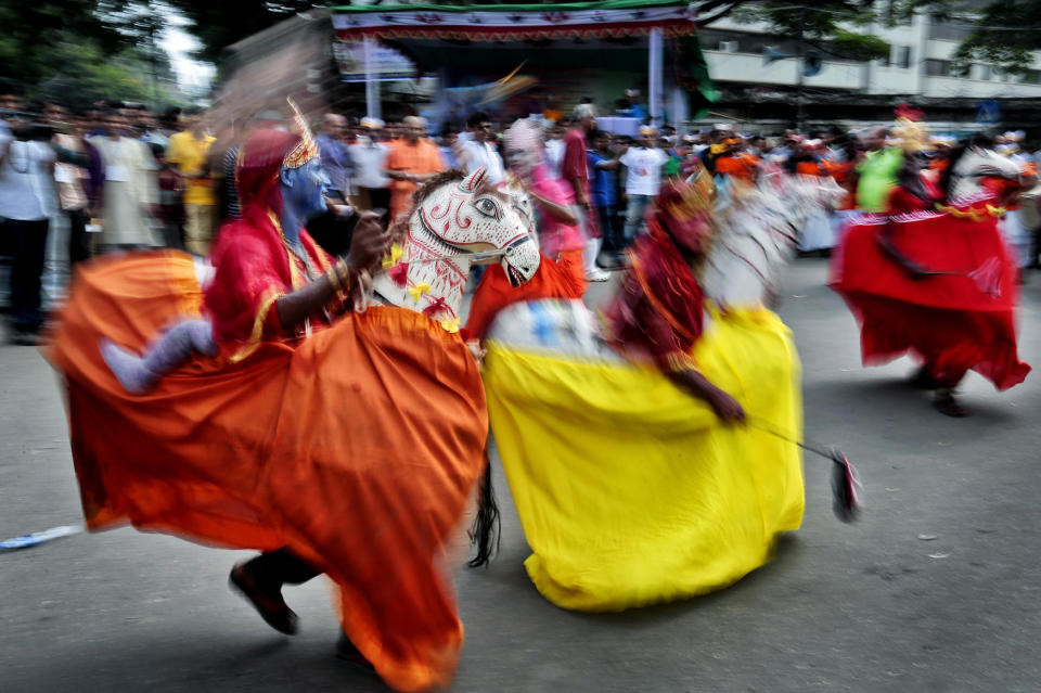<p>Bangladeshi Hindu devotees dance during a procession to celebrate ëJanmashtamií in Dhaka, Bangladesh, Aug. 25, 2016. The Janmashtami festival marks the birth of Hindu god Krishna. (Photo: A.M. Ahad/AP) </p>