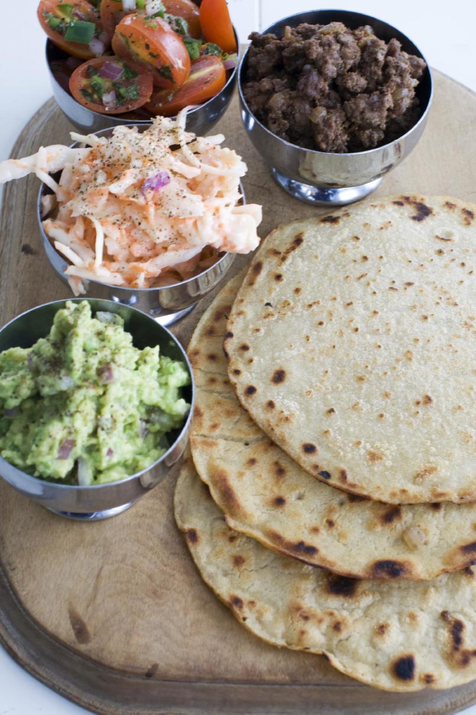 In this image taken on March 4, 2013, tortillas with tomato-mint salsa and guacamole are shown in Concord, N.H. (AP Photo/Matthew Mead)