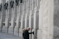 President Joe Biden and first lady Jill Biden visit the National World War II Memorial to mark the 80th anniversary of the Japanese attack on Pearl Harbor, Tuesday, Dec. 7, 2021, in Washington. (AP Photo/Evan Vucci)
