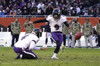 Baltimore Ravens kicker Justin Tucker (9) kicks a field goal off the hold of Sam Koch during the second half of an NFL football game Sunday, Nov. 21, 2021, in Chicago. The Ravens won 16-13. (AP Photo/David Banks)