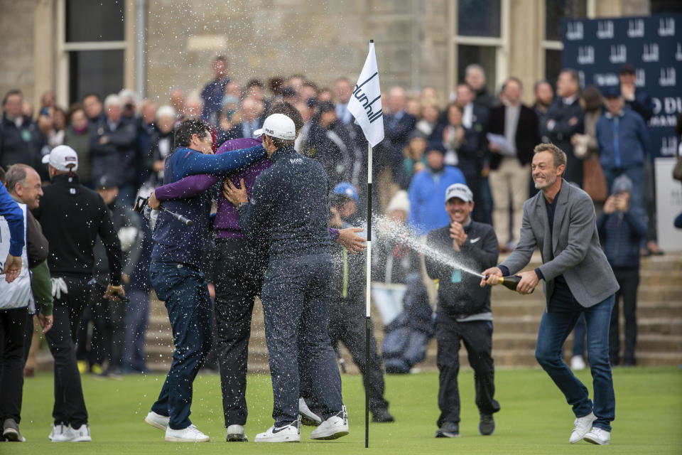 Victor Perez, centre left, is congratulated by his French Colleagues led by Raphael Jacquelin following his victory in the Links Championship at St Andrews in Scotland, Sunday Sept. 29, 2019. (Kenny Smith/PA via AP)