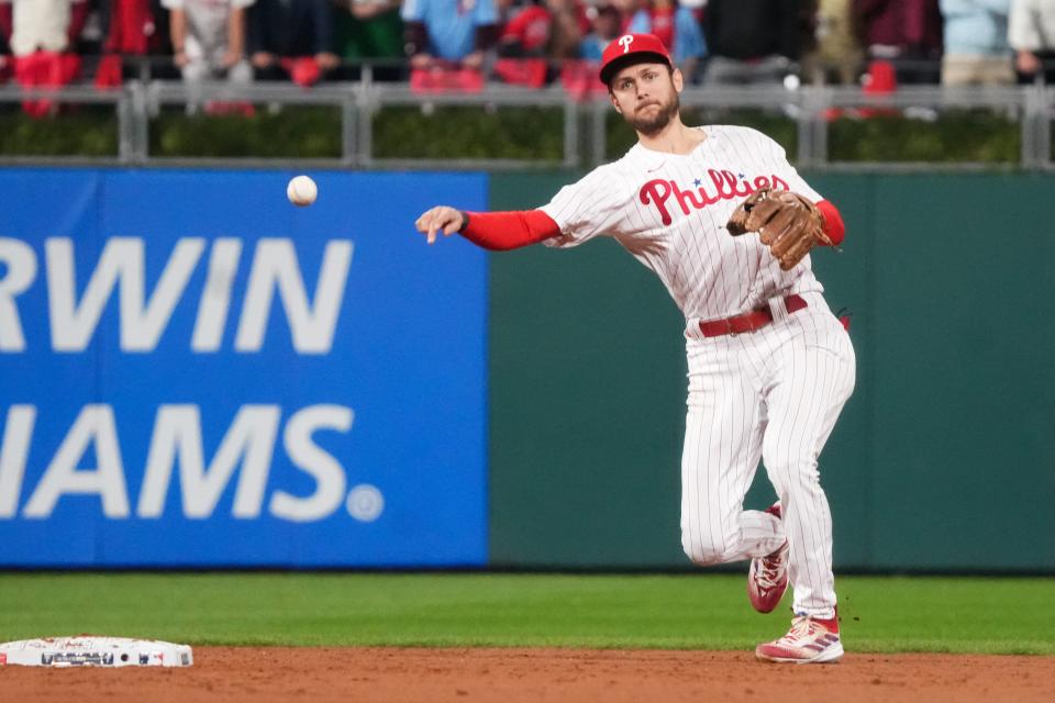 Philadelphia Phillies shortstop Trea Turner (7) throws to first to get Arizona Diamondbacks left fielder Tommy Pham (not pictured) out during the fifth inning against the Arizona Diamondbacks in game seven of the NLCS at Citizens Bank Park in Philadelphia on Oct. 24, 2023.