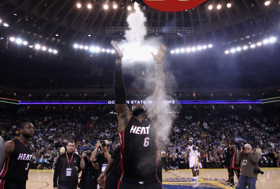 OAKLAND, CA – JANUARY 10: LeBron James #6 of the Miami Heat throws chalk in to the air before their game against the Golden State Warriors at Oracle Arena on January 10, 2012 in Oakland, California. NOTE TO USER: User expressly acknowledges and agrees that, by downloading and or using this photograph, User is consenting to the terms and conditions of the Getty Images License Agreement. (Photo by Ezra Shaw/Getty Images)