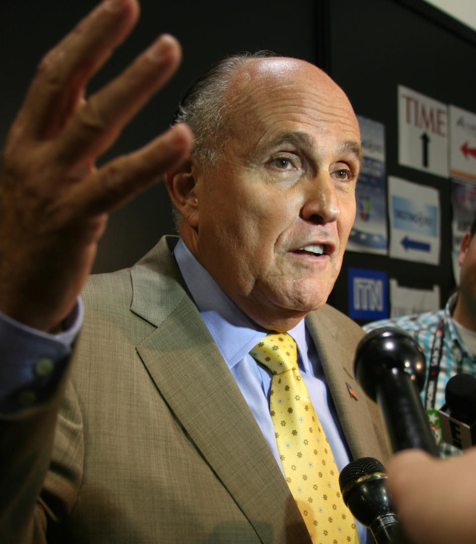 Former New York City Mayor Rudy Giuliani talks to reporters in the media filing center for the Republican Naitonal Convention on Wednesday, Aug. 29, 2012. (Torrey AndersonSchoepe/Yahoo! News)