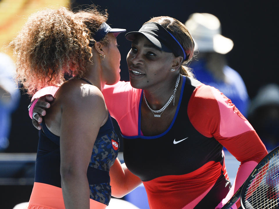 Japan's Naomi Osaka, left, is congratulated by United States' Serena Williams after winning their semifinal match at the Australian Open tennis championship in Melbourne, Australia, Thursday, Feb. 18, 2021.(AP Photo/Andy Brownbill)