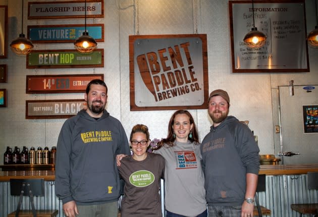 Bryon Tonnis, Karen Tonnis, Laura Mullen, and Colin Mullen, the founders of <a href="http://www.bentpaddlebrewing.com/" rel="nofollow noopener" target="_blank" data-ylk="slk:Bent Paddle Brewing;elm:context_link;itc:0;sec:content-canvas" class="link ">Bent Paddle Brewing</a> company in Duluth, Minnesota. Their company’s story illustrates the economic patterns that Jeff Alworth is describing. (James Fallows)