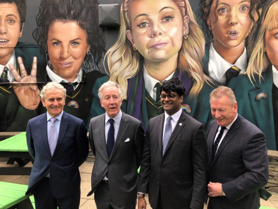 Congressman Richard Neal (second left) visits the Derry Girls mural (David Young/PA) (PA Wire)