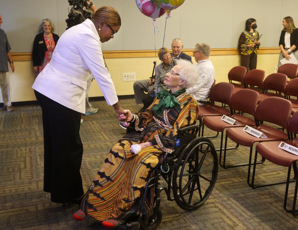 Dr. Alice Young is greeted by MCC President, DeAnna Burt-Nanna during a celebration of Young’s 100th birthday.