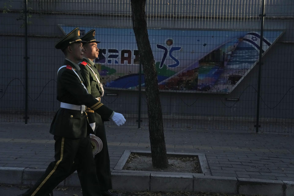 Chinese paramilitary policemen patrol outside the Israeli Embassy in Beijing, Friday, Oct. 13, 2023. An employee of the Israeli Embassy in Beijing has been attacked and was later hospitalized, according to a statement from Israel's Foreign Ministry on Friday. (AP Photo/Ng Han Guan)
