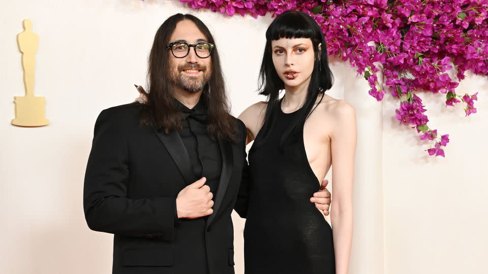 Sean Lennon, son of John Lennon and Yoko Ono, arrived with partner Kemp Muhl in matching black ensembles. - Gilbert Flores/Variety/Getty Images