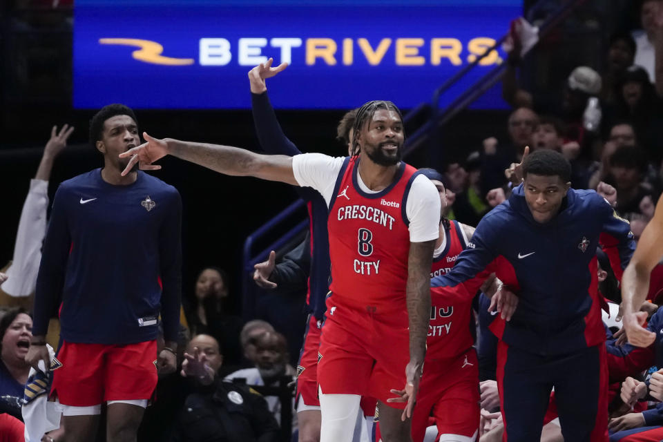 New Orleans Pelicans forward Naji Marshall (8) reacts after making a 3-point basket in the first half of an NBA basketball play-in tournament game against the Sacramento Kings in New Orleans, Friday, April 19, 2024. (AP Photo/Gerald Herbert)