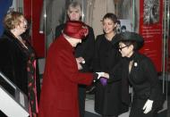 <p>Years after her husband’s assassination, Yoko Ono met Queen Elizabeth at the Museum of Liverpool. For the royal occasion, Yoko wore a black suit, hat, and white gloves.</p>