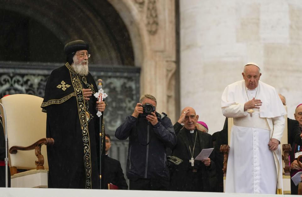 Pope Francis, right, starts his weekly general audience in St. Peter's Square at The Vatican, with the leader of the Coptic Orthodox Church of Alexandria, Tawadros II,Wednesday, May 10, 2023. (AP Photo/Alessandra Tarantino)