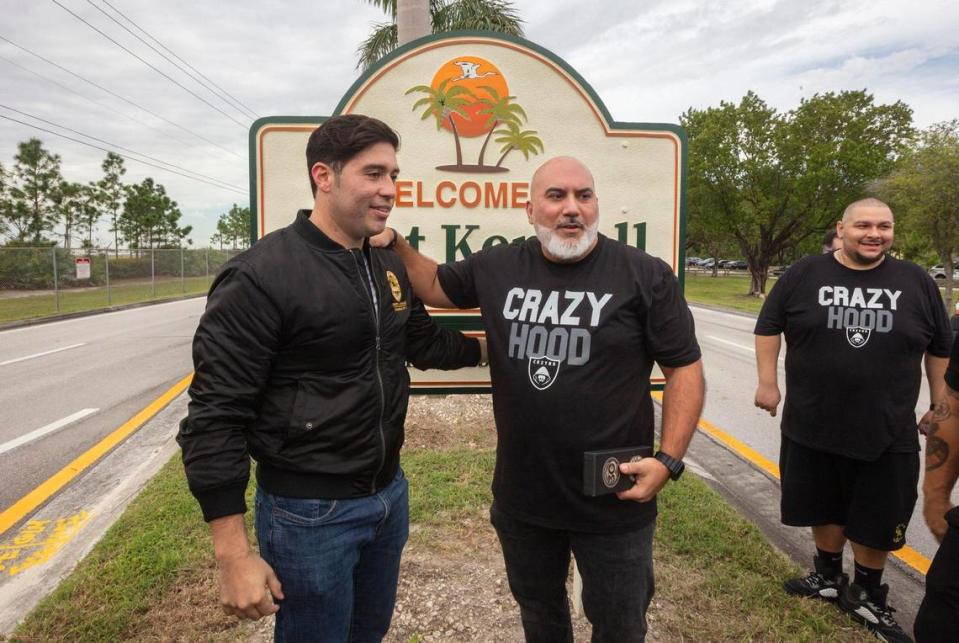 Commissioner Roberto J. Gonzalez (l)and Eric Narciandi (r), President of Crazy Hood Productions, in front of the West Kendall sign unveiled in Kendall on Friday October 20th., 2023.