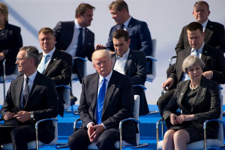 (L-R) NATO Secretary General Jens Stoltenberg, US President Donald Trump and British Prime Minister Theresa May attend the handover ceremony of the new headquarters of NATO in Brussels, on May 25, 2017