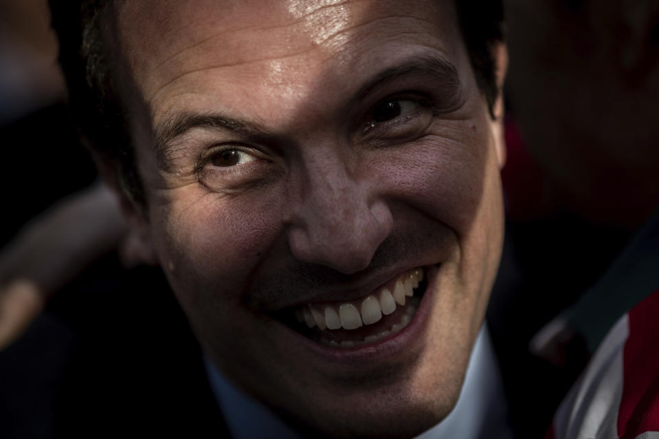 In this Tuesday, April 16, 2019 photo, Popular Party's candidate Pablo Casado smiles to supporters during an election campaign event in Madrid, Spain. Pablo Casado is facing his first electoral test at the head of the Popular Party, Spain's dominant political party on the right for the past three decades. (AP Photo/Bernat Armangue)