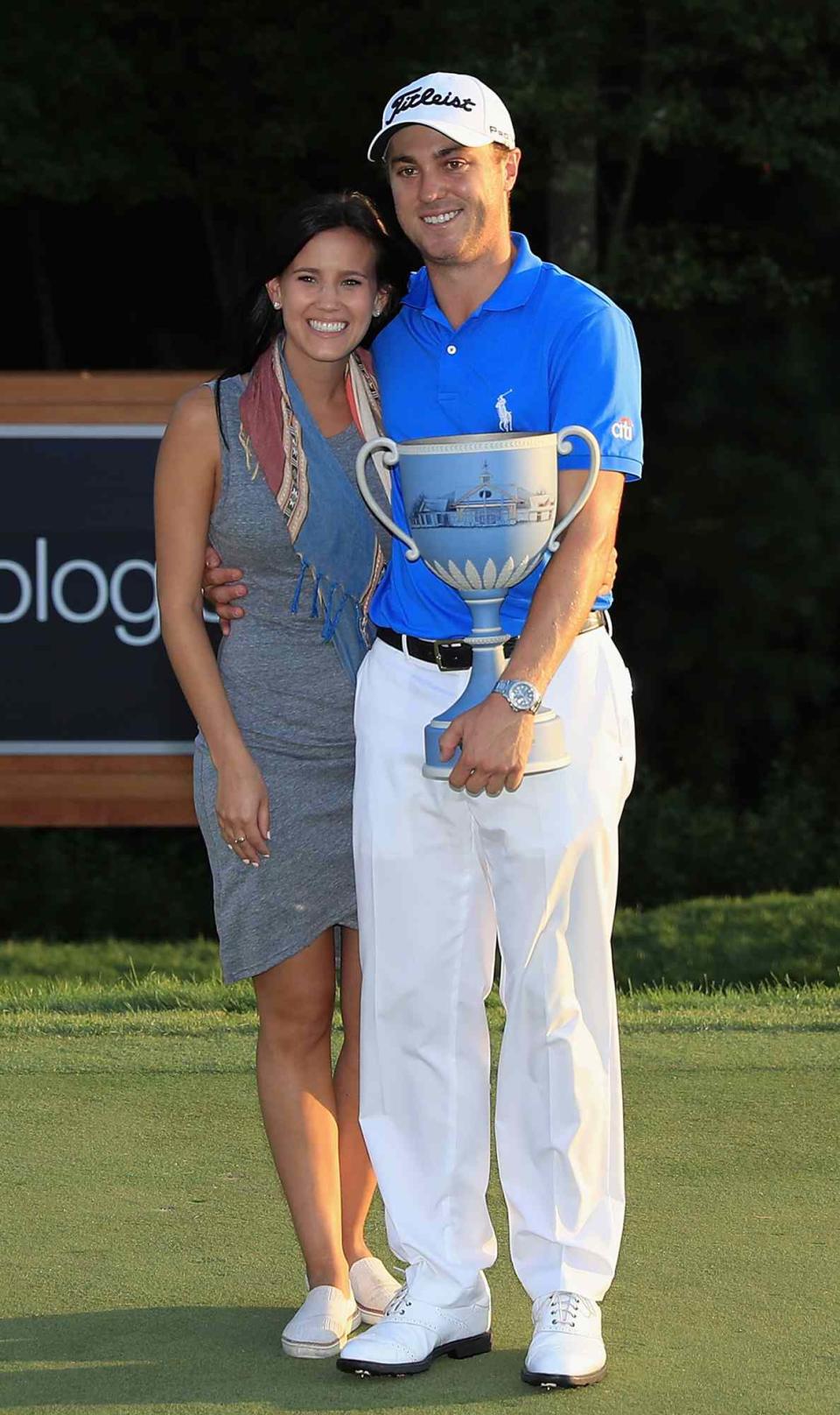 Justin Thomas of the United States poses with girlfriend Jillian Wisniewski after winning the Dell Technologies Championship at TPC Boston on September 4, 2017 in Norton, Massachusetts