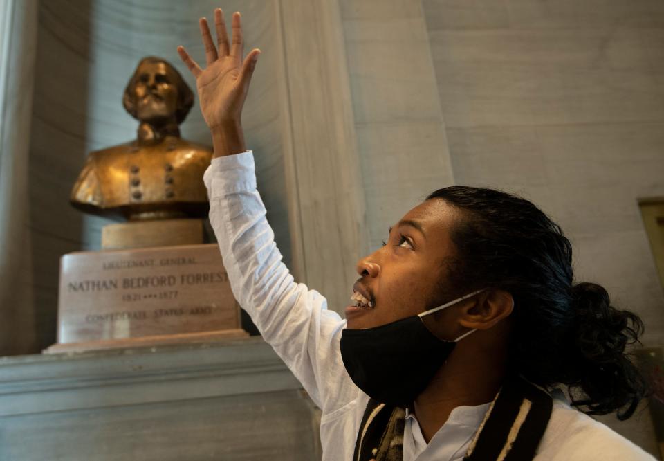 Activist Justin Jones gives praise to God at the Nathan Bedford Forrest bust in the State Capitol on July 22, 2021, in Nashville after the removal of the bust of the Confederate officer and Ku Klux Klan Grand Wizard was approved by by the State Building Commission. Jones, 26, will represent the 52nd District in the Tennessee General Assembly.