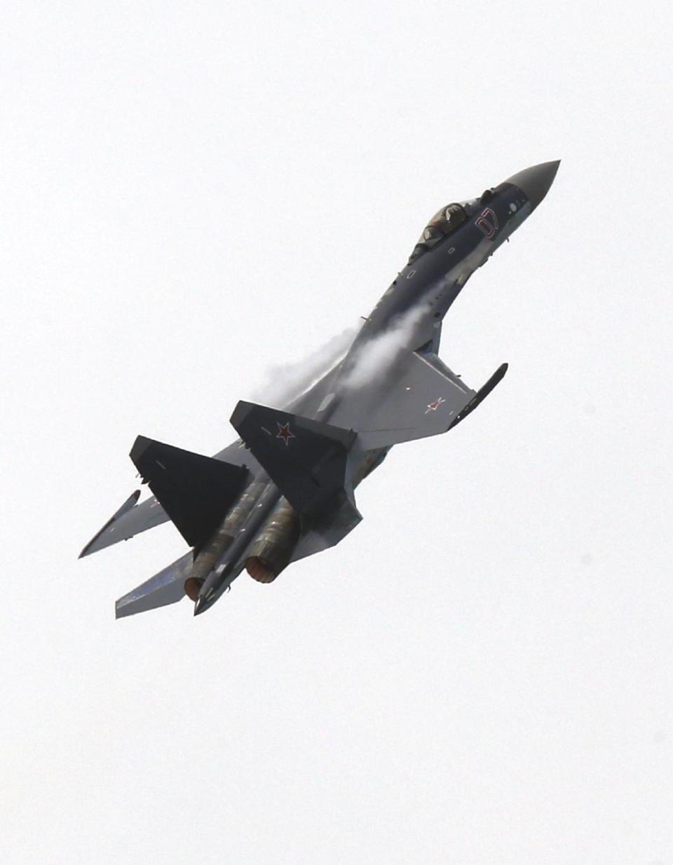 Russian air force Sukhoi su-139 fighters performs during their presentation at Paris Air Show in le Bourget, North of Paris, France, Sunday, June 16, 2013. The Paris Air Show will open on June 17 at Le Bourget. (AP Photo/Jacques Brinon)