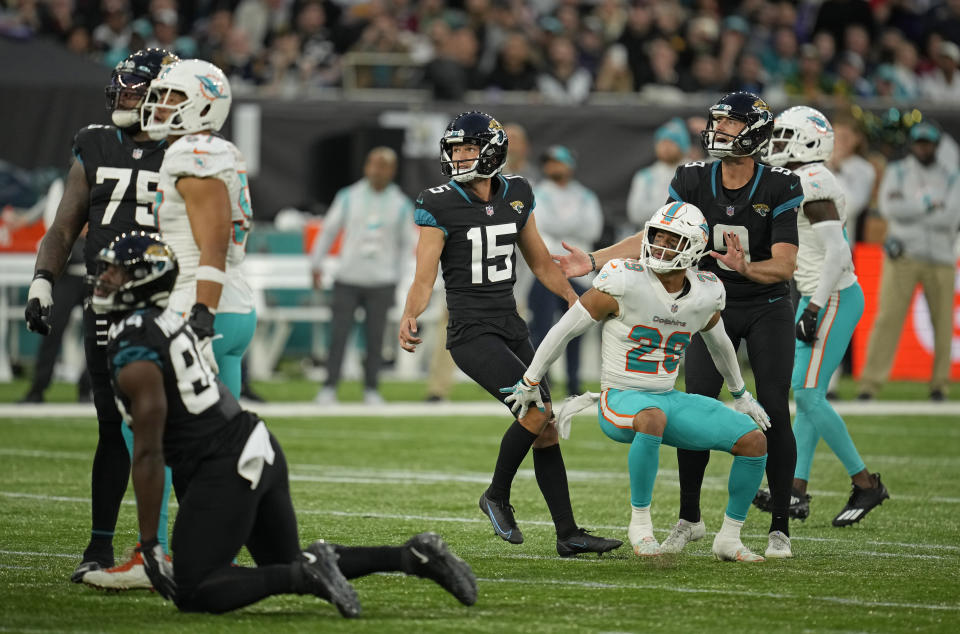 Jacksonville Jaguars kicker Matthew Wright (15), center, looks up as he kicks a field goal to win the match during the second half of an NFL football game between the Miami Dolphins and the Jacksonville Jaguars at the Tottenham Hotspur stadium in London, England, Sunday, Oct. 17, 2021. (AP Photo/Matt Dunhan)