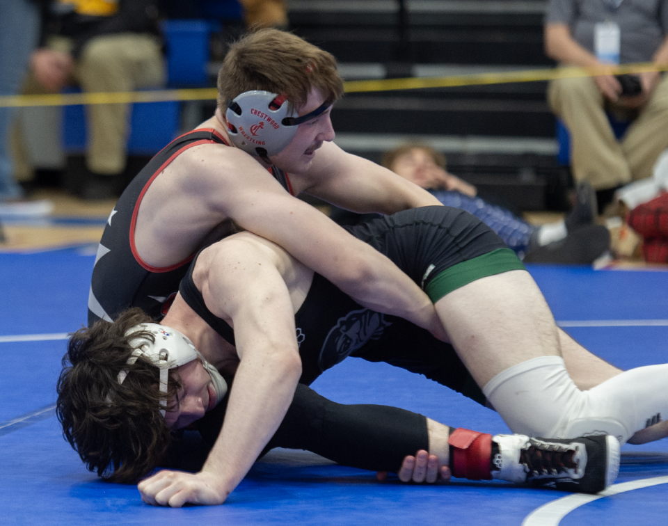 Aurora's Drake Brasiel, right, pictured at the Portage County Tournament.