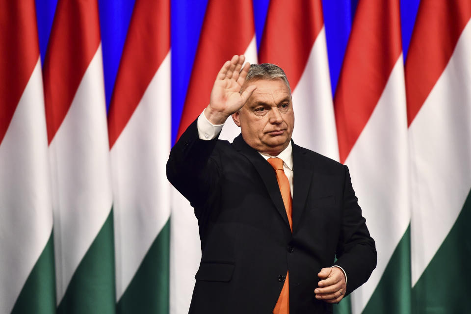 Viktor Orban waves after his annual state of the nation speech in Varkert Bazaar conference hall of Budapest, Hungary, Saturday, Feb 12, 2022. He is preparing with his right-wing party FIDESZ for the upcoming elections on April 3. (AP Photo/Anna Szilagyi)