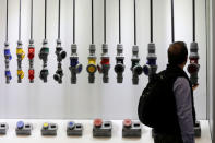 A visitor checks products during the China Import and Export Fair, also known as Canton Fair, in the southern city of Guangzhou, China April 16, 2018. REUTERS/Tyrone Siu