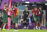 Portugal's Cristiano Ronaldo enters on the pitch during the World Cup round of 16 soccer match between Portugal and Switzerland, at the Lusail Stadium in Lusail, Qatar, Tuesday, Dec. 6, 2022. (AP Photo/Pavel Golovkin)