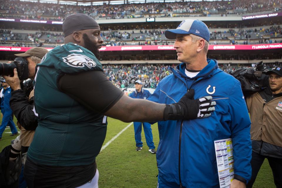 Indianapolis Colts head coach and former offense coordinator Frank Reich, right, speaks with the Eagles' Jason Peters after the game Sunday at Lincoln Financial Field. The Eagles defeated the Colts 20-16.