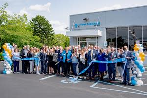 Christopher Becker, President and CEO cuts the ribbon on First National Bank LI’s newly relocated Bohemia location in celebration with Bank staff and loyal customers. Pictured front row left to right: Janet Verneuille, EVP Chief Risk Officer; Neil Spare, Sayville Ford; Melanie Spare-Oswalt, Sayville Ford; Margaret Curran, SVP Middle Market Team Leader; Angela Reese, SVP Branch District Manager; Karen McGuigan, Concept Components Co.; Suzanne Fox, VP Branch Manager; Christopher Becker, President and CEO; Dorothy Overton, VP Branch Market Manager; Lynnett Cawley, AC Universal Banker II; Phyllis Kern, Teller; Kenneth Ruland, SVP Middle Market Team Leader; Jaqueline Brown, SVP, Branch District Manager; Jay P. McConie, EVP Chief Financial Officer; Leonardo Tavera, SVP Corporate Planning Officer.