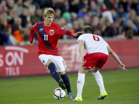 Norway's Martin Odegaard (L) is challenged by Malta's Paul Fenech during their Euro 2016 qualifying soccer match in Ullevaal Stadium in Oslo, October 10, 2015. REUTERS/Cornelius Poppe/NTB Scanpix