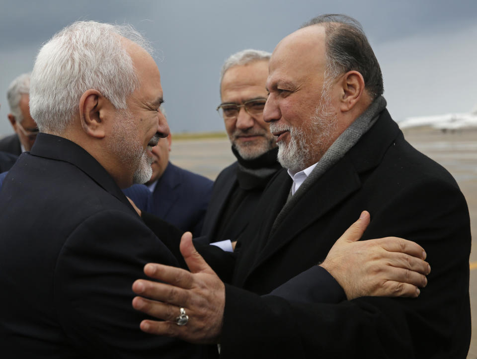 Iran's Foreign Minister Mohammad Javad Zarif, left, greets by Lebanese Hezbollah lawmaker, Ali Ammar, upon his arrival at Rafik Hariri Airport, in Beirut, Lebanon, Sunday, Feb. 10, 2019. Zarif said his country is ready to cooperate with the new Lebanese government, offering his country's support in all sectors. (AP Photo/Hussein Malla)