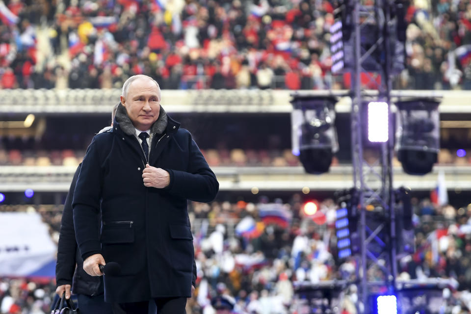 Russian President Vladimir Putin arrives to attend a concert a day before the Defender of the Fatherland Day, a holiday honoring Russia's armed forces at the Luzhniki Stadium in Moscow, Russia, Wednesday, Feb. 22, 2023. (Maxim Blinov, Sputnik, Kremlin Pool Photo via AP)