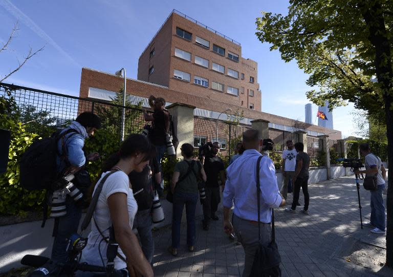 Journalists stand outside the Carlos III hospital in Madrid after the arrival of Roman Catholic priest Miguel Pajares, who contracted the deadly Ebola virus in Liberia, on August 7, 2014
