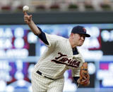 FILE - Minnesota Twins' Tyler Duffy throws against the Detroit Tigers in the fourth inning during a baseball game in Minneaolis, in this Aug. 18, 2018, file photo. The Minnesota Twins signed Alex Colomé away from their chief divisional competition, the Chicago White Sox, to bring in a proven closer to the back of the bullpen. The Twins won't formally assign that role, though, with Taylor Rogers, Hansel Robles and Tyler Duffey all in position for ninth-inning outs. (AP Photo/Andy Clayton-King, File)