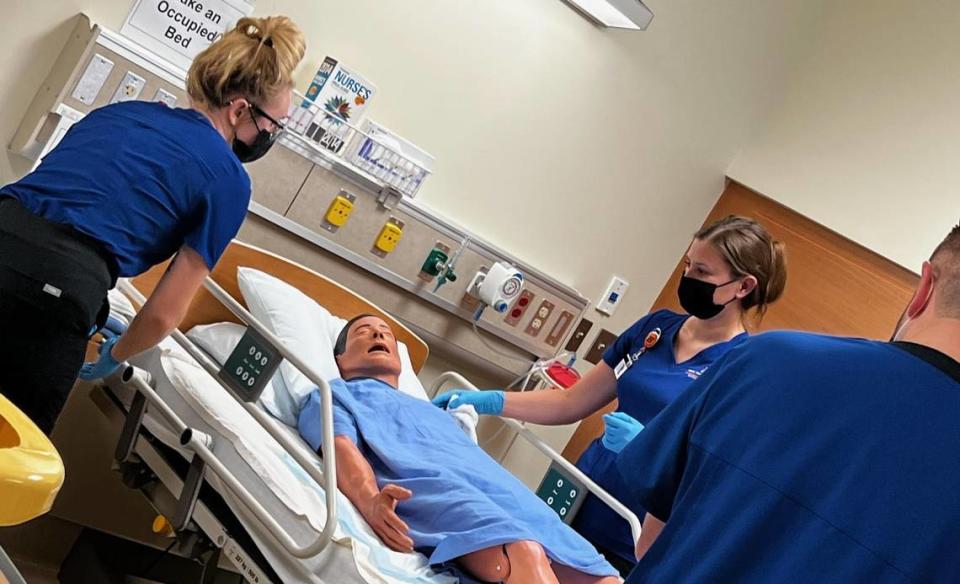 Boise State University nursing students interact with a “low-fidelity mannequin” in the skills lab at Boise State. Boise State started using such simulation labs about 13 years ago. Such labs now account for about 50% of clinical hours for nursing students at Boise State.