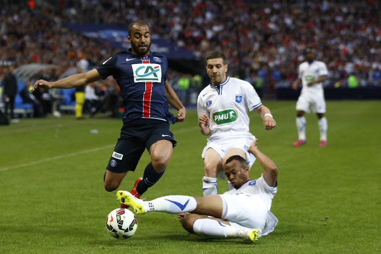 Paris Saint-Germain's Brazilian midfielder Lucas Moura (L) is tackled by Auxerre's defender Thomas Fontaine (R) during the French Cup final football match on May 30, 2015 at the Stade de France stadium in Saint-Denis, near Paris