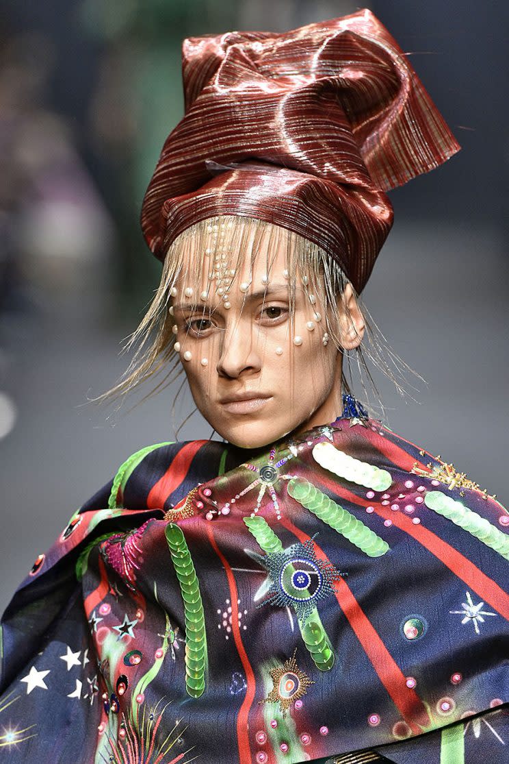 Models walked the runway at the 2017 Manish Arora fashion show with hair turbans made from hair extensions and acrylic paint. (Photo: Getty Images)