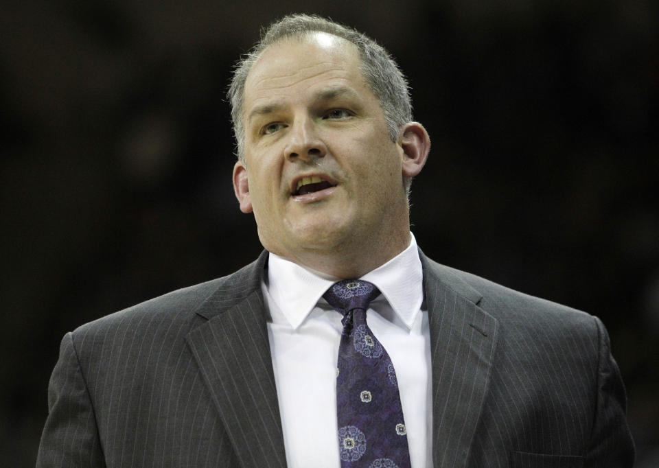 Portland coach Eric Reveno on bench against Washington during an NCAA college basketball game Monday, Dec. 6, 2010, in Seattle. (AP Photo/Elaine Thompson)