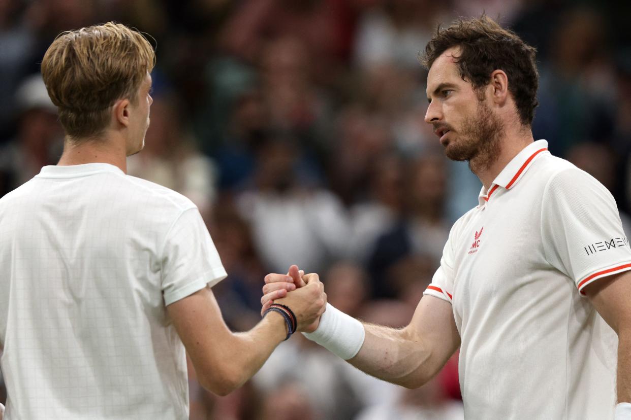 Canada's Denis Shapovalov (L) greets Britain's Andy Murray after winning their men's singles third round match on the fifth day of the 2021 Wimbledon Championships at The All England Tennis Club in Wimbledon, southwest London, on July 2, 2021. - RESTRICTED TO EDITORIAL USE (Photo by Adrian DENNIS / AFP) / RESTRICTED TO EDITORIAL USE (Photo by ADRIAN DENNIS/AFP via Getty Images)