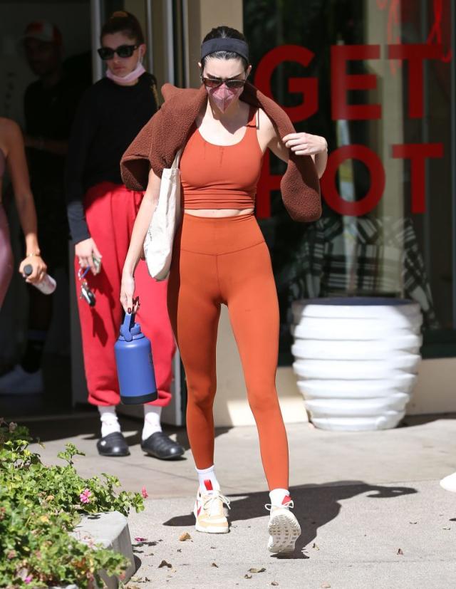 Kendall Jenner shows off endless pins in walnut brown leggings as she steps  out in her mask in LA