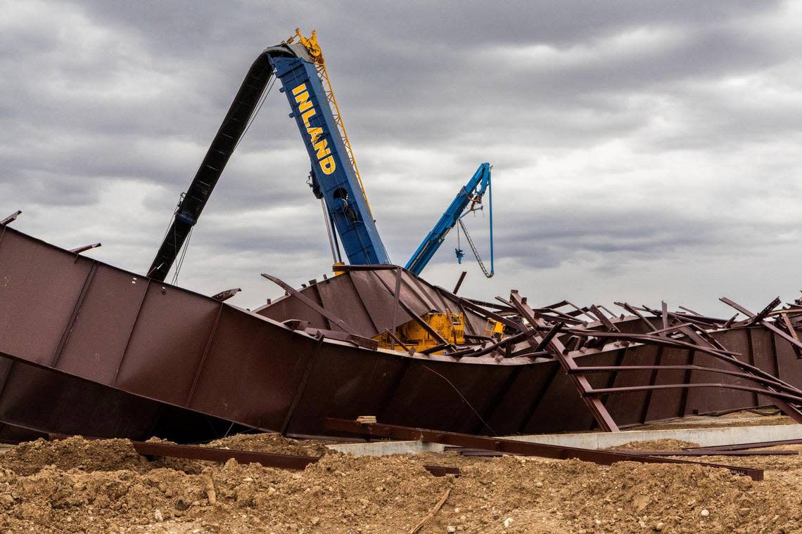 A crane tangled in steel beams following the collapse of an aircraft hangar under construction near the Boise Airport.