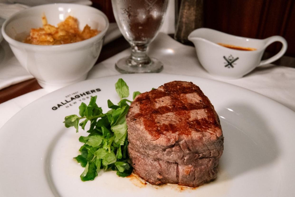 Steaks at Gallaghers Steakhouse are dry-aged onsite and grilled over hickory coal. The iconic New York steakhouse opened a Boca Raton location July 19.