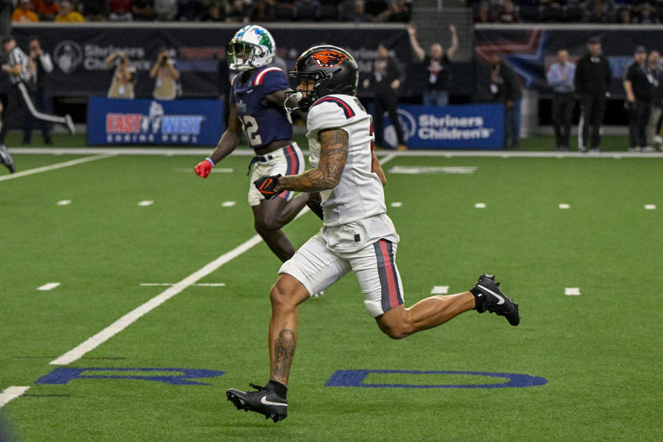Feb 1, 2024; Frisco, TX, USA; East wide receiver Anthony Gould of Oregon State (2) returns a punt for a touchdown against the West during the second half at the Ford Center at The Star. Mandatory Credit: Jerome Miron-USA TODAY Sports