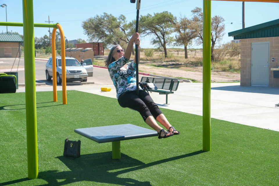 Mary Hiner enjoys the playground of the newly built Kylie Hiner Memorial Park Thursday in Canyon.