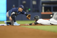 Tampa Bay Rays second baseman Yu Chang, left, waits for the throw as Miami Marlins' Jon Berti steals second during the fourth inning of a baseball game Wednesday, Aug. 31, 2022, in Miami. (AP Photo/Lynne Sladky)