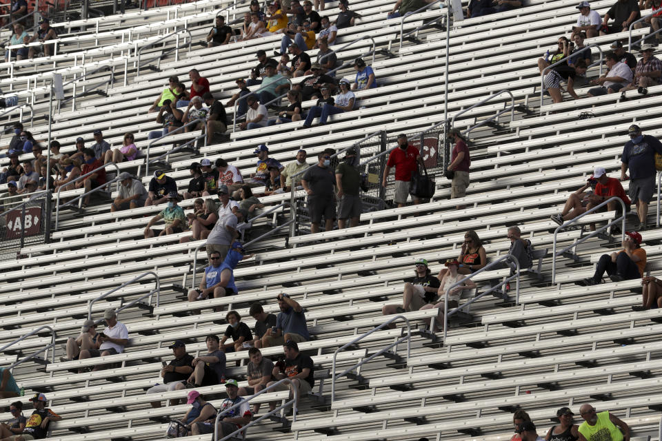 Fans wait for the start of a NASCAR All-Star Open auto race at Bristol Motor Speedway in Bristol, Tenn, Wednesday, July 15, 2020. (AP Photo/Mark Humphrey)