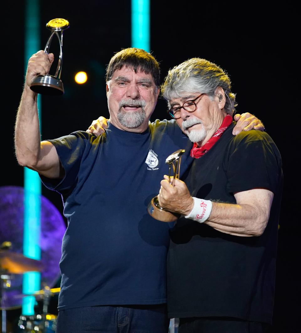 Teddy Gentry and Randy Owen of Alabama hold their Pinnacle Awards after they were honored at CMA Fest at Nissan Stadium on Sunday, June 11, 2023, in Nashville, Tennessee.